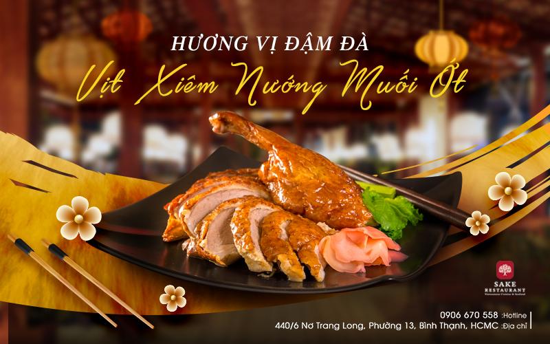 món ăn vịt xiêm nướng muối ớt cùng logo sake restaurant và dòng địa chỉ 440/6 nơ trang long, phường 13, bình thạnh, hcmc